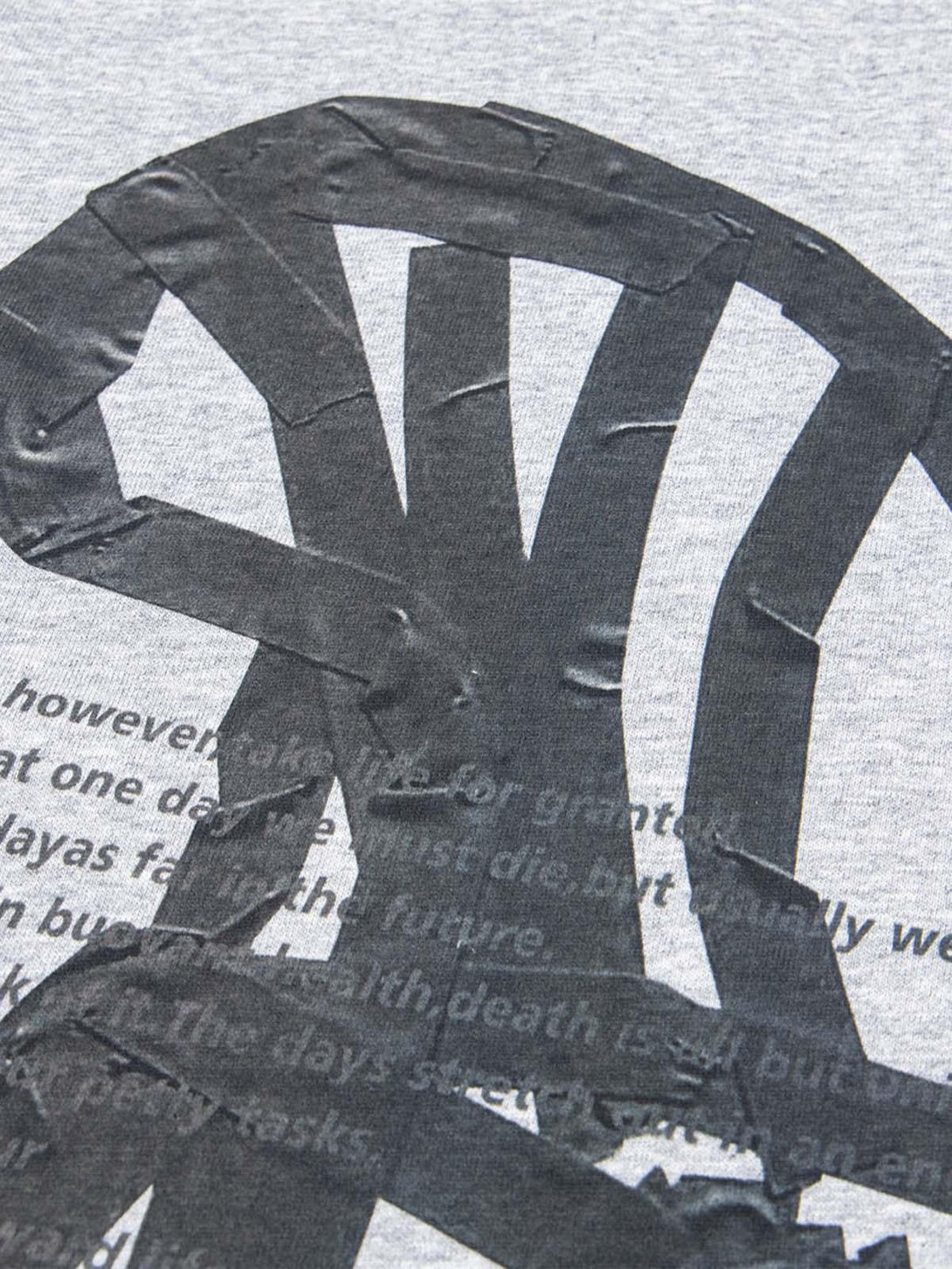 Detailed view of TALISHKO T-shirt, highlighting retro chair graphic and lettering texture.