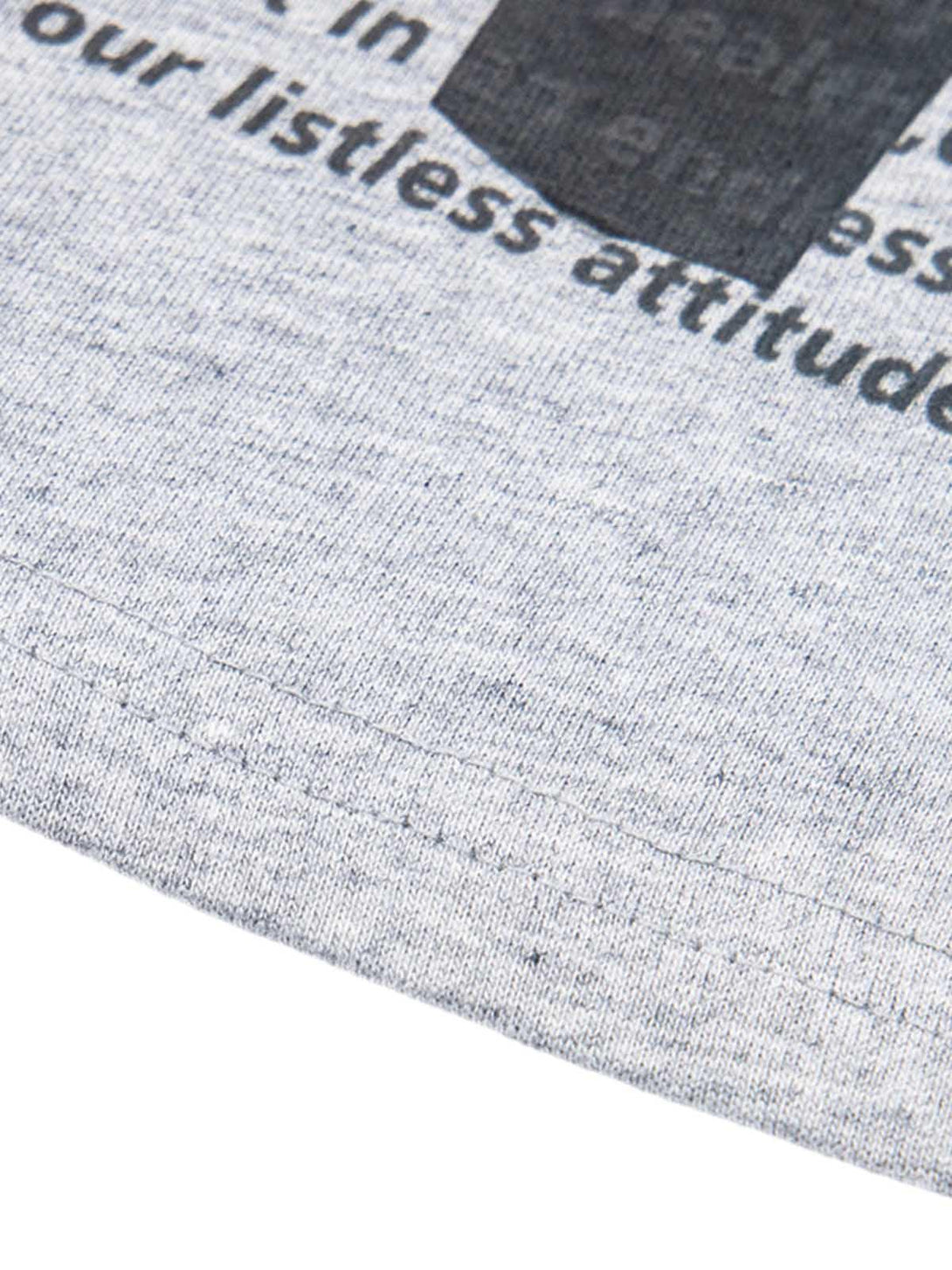 Intricate look at the TALISHKO T-shirt fabric, emphasizing the retro lettering design.