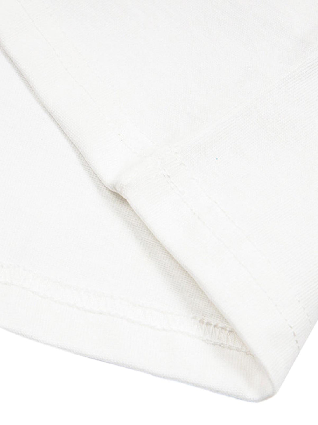 Detailed stitching on a white T-shirt by TALISHKO, highlighting quality craftsmanship.