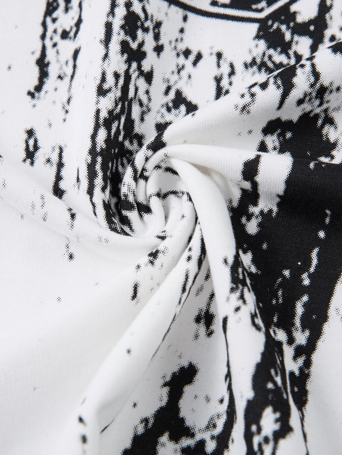 Texture and pattern showcased in TALISHKO's retro graffiti T-shirt, highlighting black and white details.