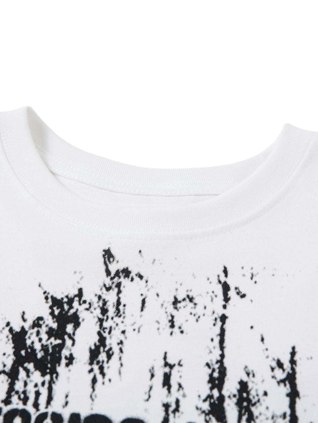 Zoomed-in texture of TALISHKO's retro graffiti lettering T-shirt, highlighting unique black patterns.