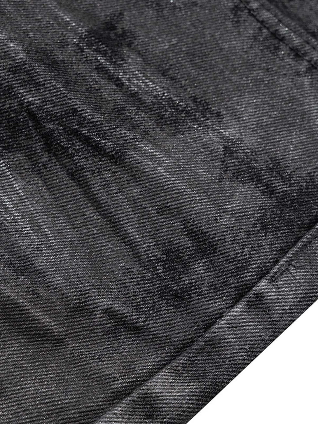 Intricate look at TALISHKO's retro hand-brushed flare jeans, highlighting the glitter texture.