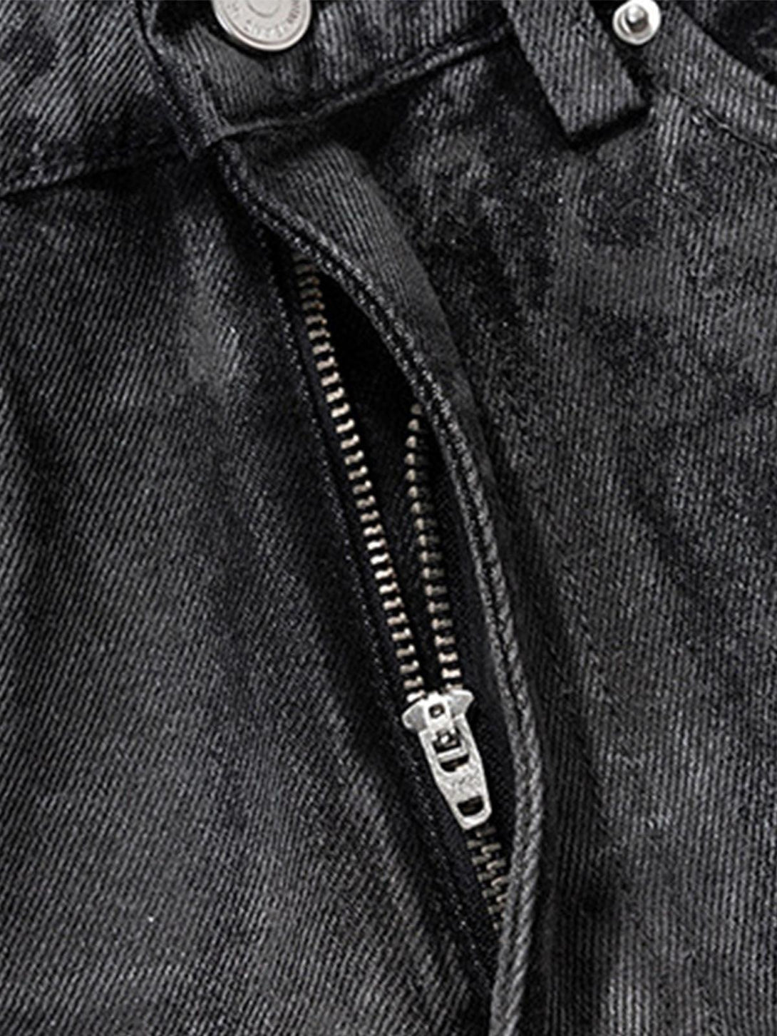 Zipper detail of TALISHKO retro hand-brushed glitter flare jeans, highlighting texture.