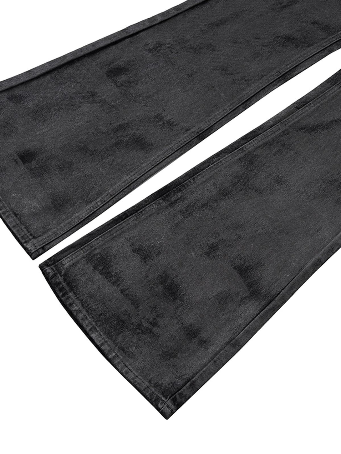 A detailed view of TALISHKO's retro hand-brushed flare jeans, showcasing the unique fabric texture.