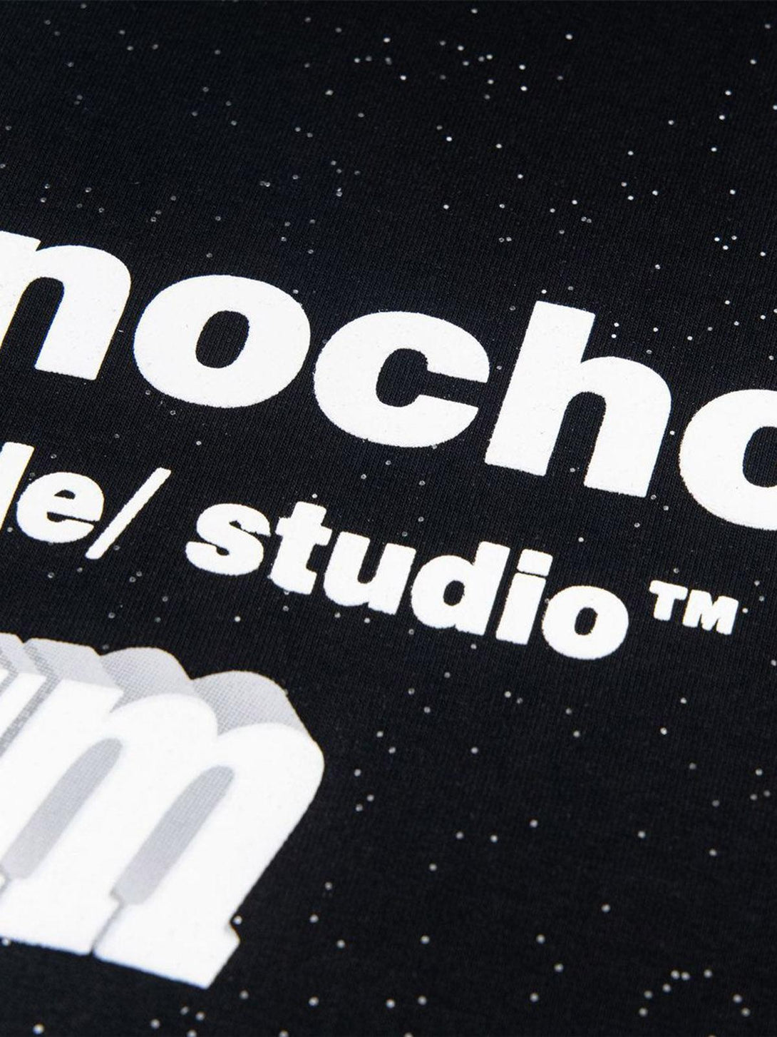 Detailed fabric and bold font on TALISHKO's starry sky print short-sleeved T-shirt.