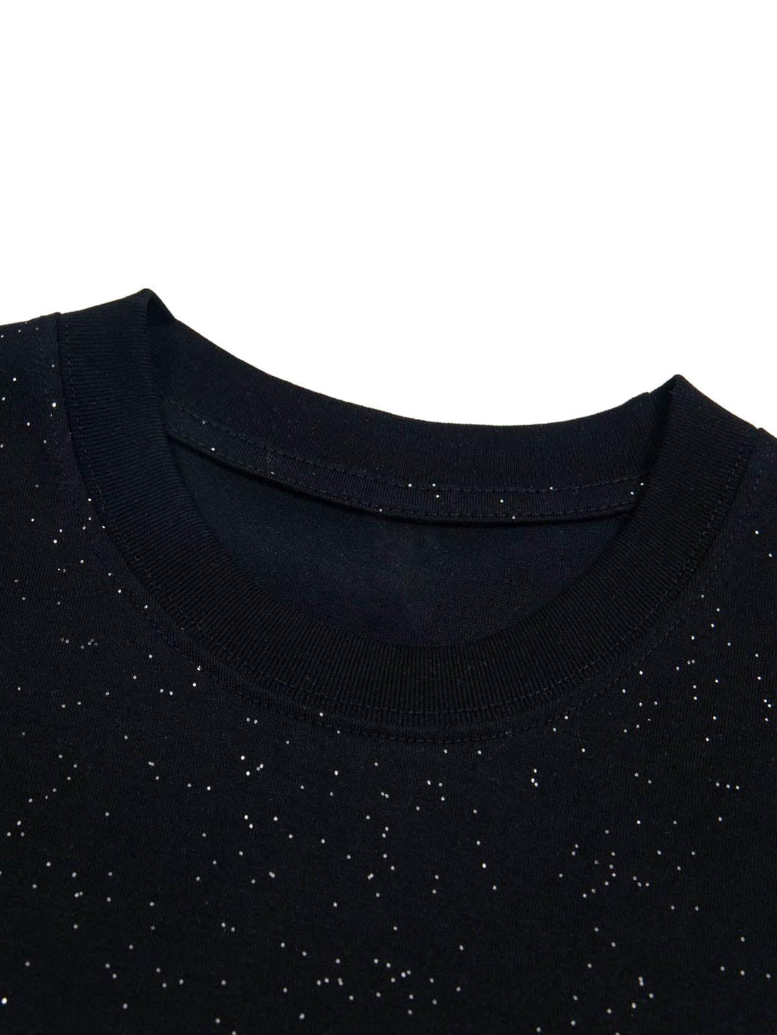 Zoomed-in texture of TALISHKO's starry sky print on a black short-sleeved t-shirt.