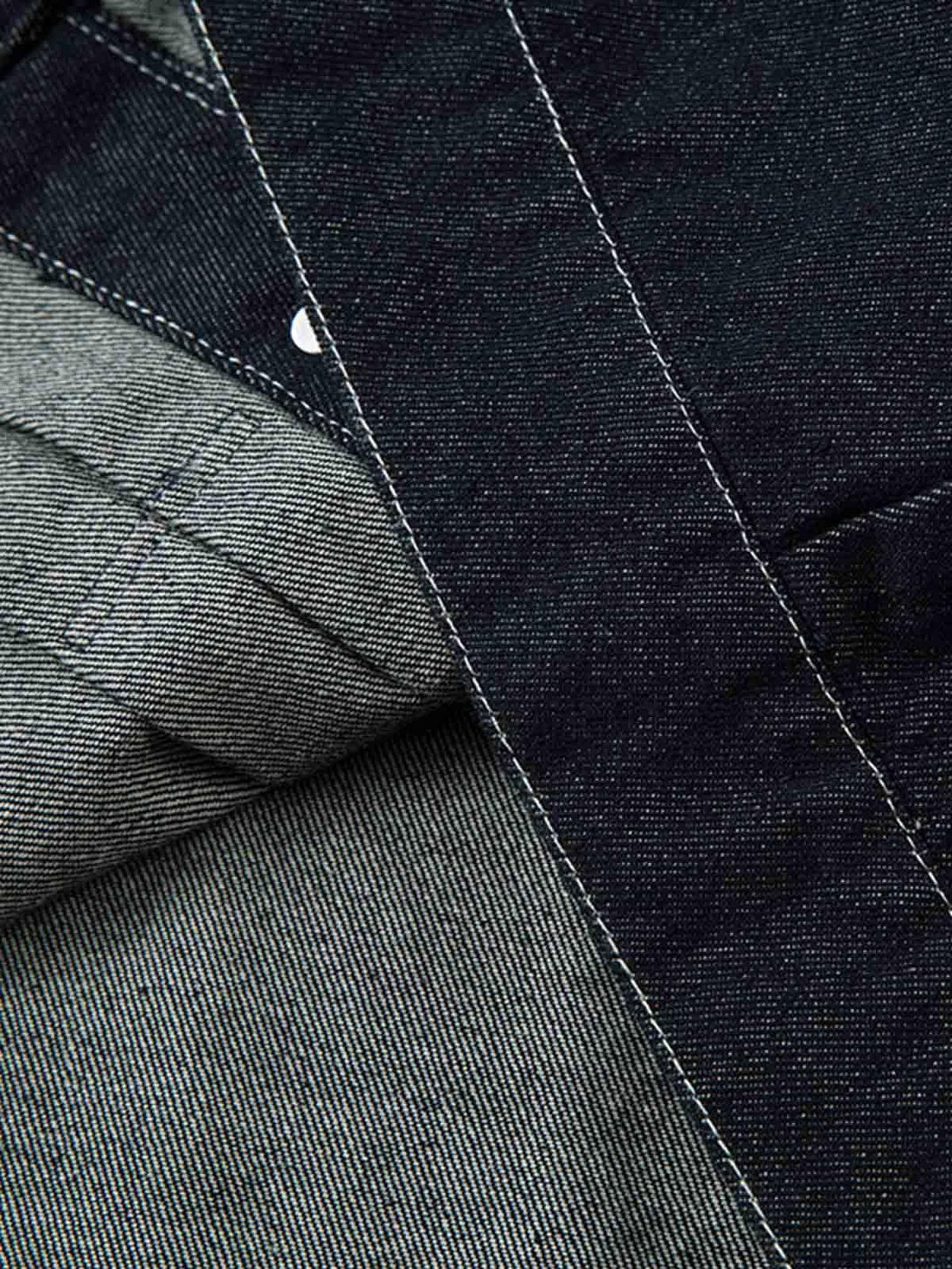 Detailed fabric and stitching on TALISHKO's denim jacket, highlighting retro craftsmanship.
