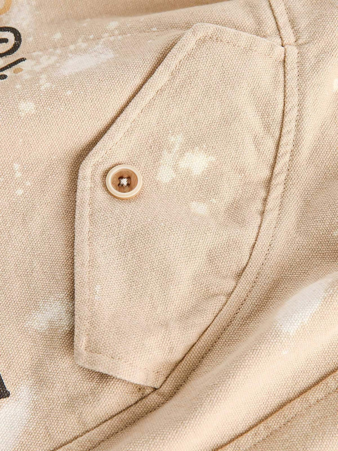 Detailed fabric and pocket design of TALISHKO hip-hop shorts, highlighting unique patterns.