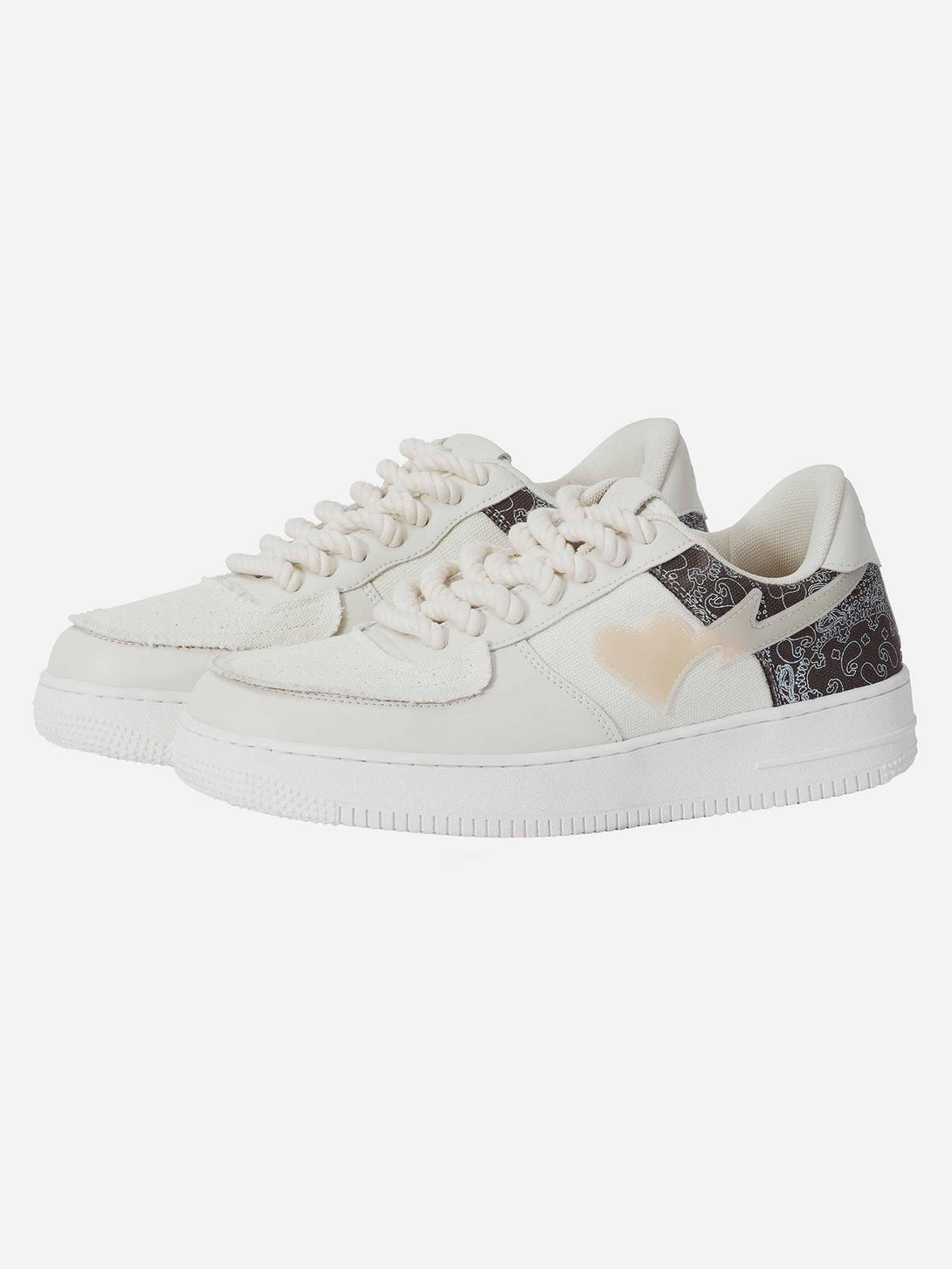 TALISHKO men's low-top skate shoes in cream, showcasing unique heart and pattern accents.