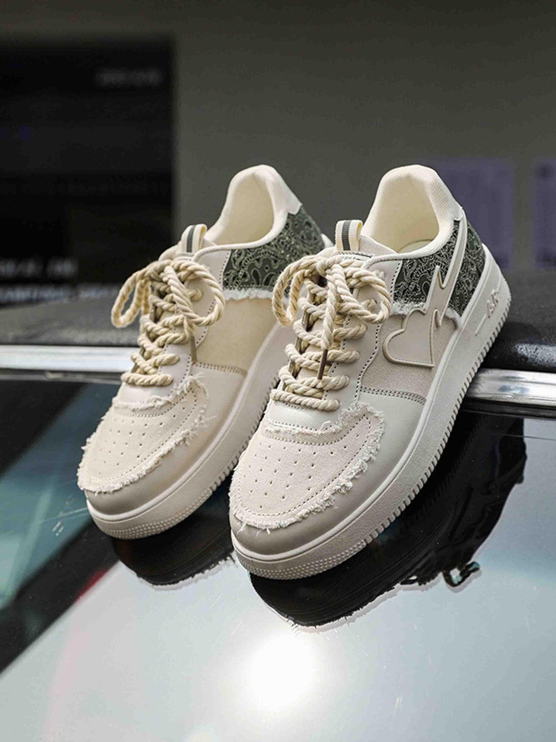 Stylish low-top skate shoes by TALISHKO, featuring intricate heart and pattern details.