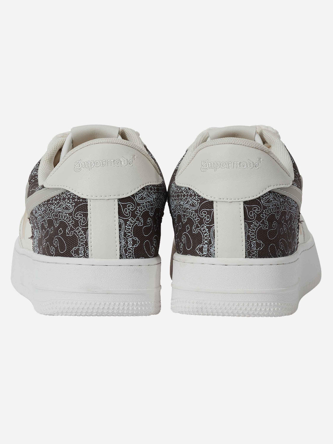 Rear view of TALISHKO skate shoes highlighting intricate pattern details and logo design.