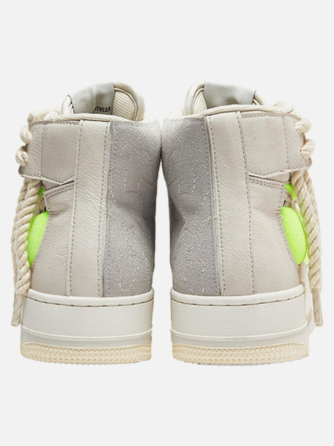 Back view of TALISHKO retro high-top sneakers featuring unique stitching and neon green accents.
