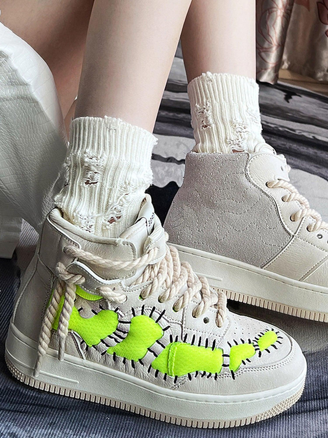 TALISHKO retro high-top sneakers with neon green design, paired with distressed white socks.