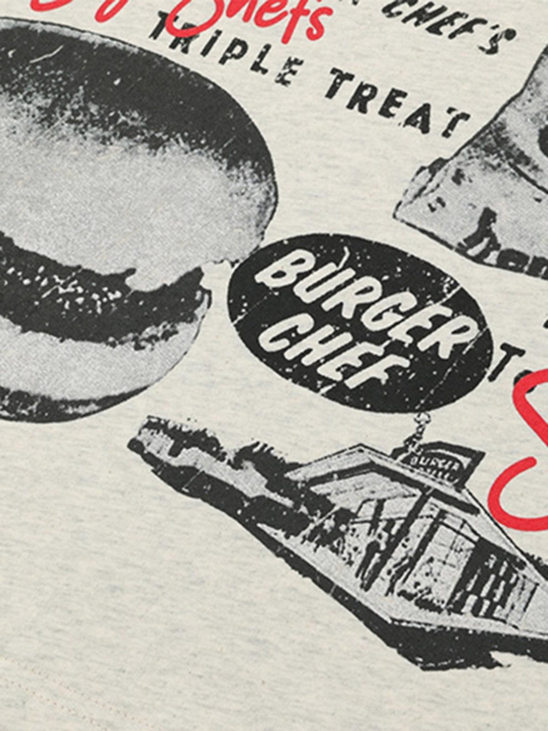 A detailed view of TALISHKO T-shirt featuring vintage black and white retro graphics.