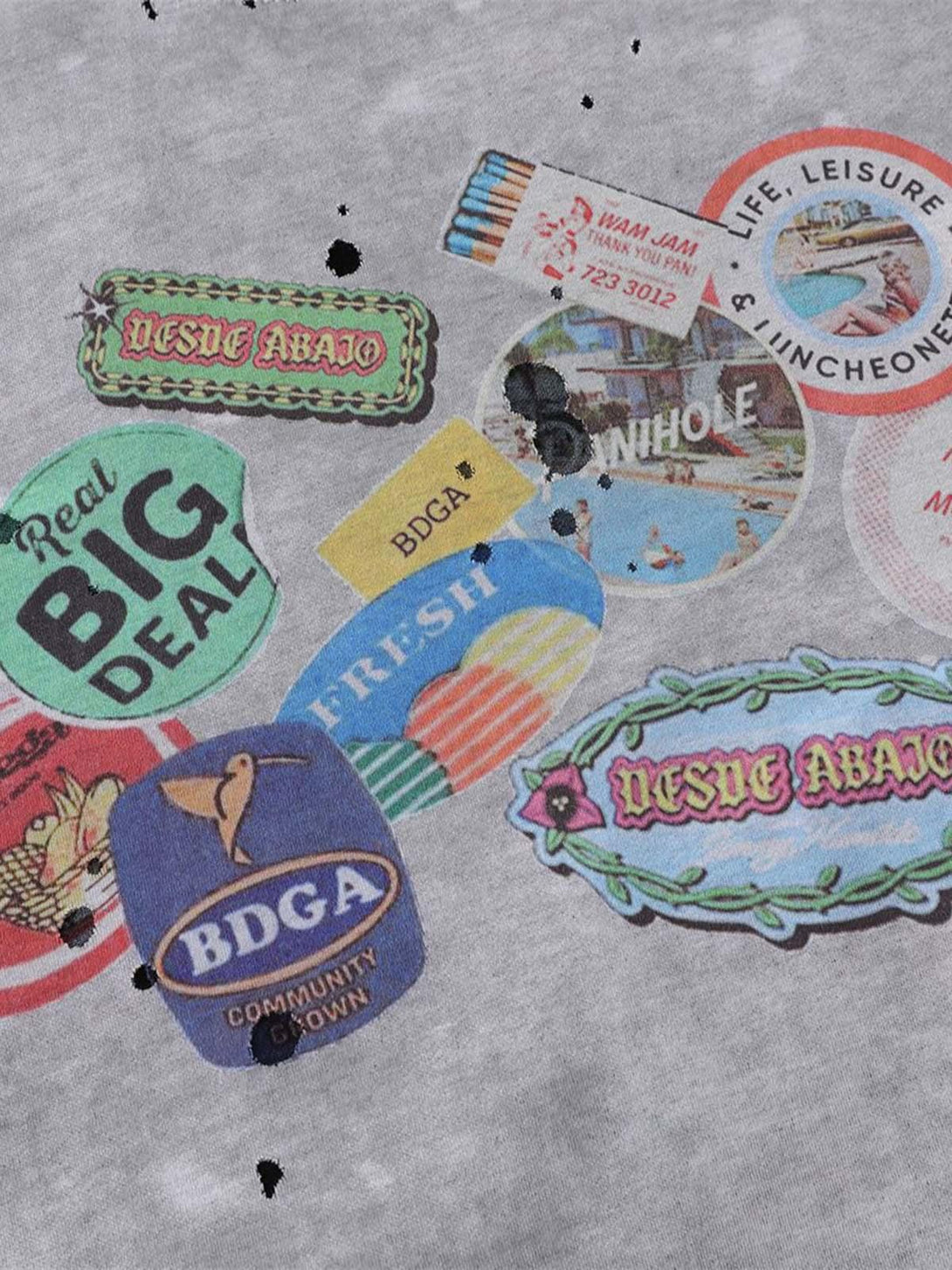 Graphic close-up on gray Retro Ink Splash T-shirt by TALISHKO, featuring vibrant vintage-inspired prints.