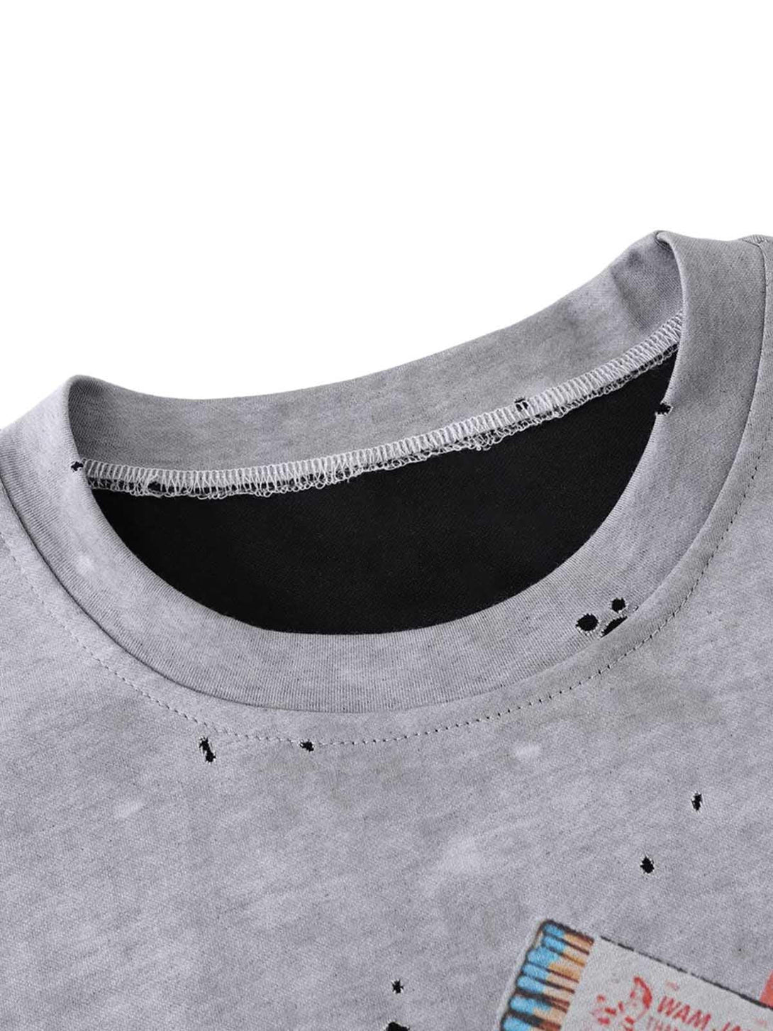 The neckline detail of TALISHKO's retro ink splash T-shirt, featuring artistic distressing.