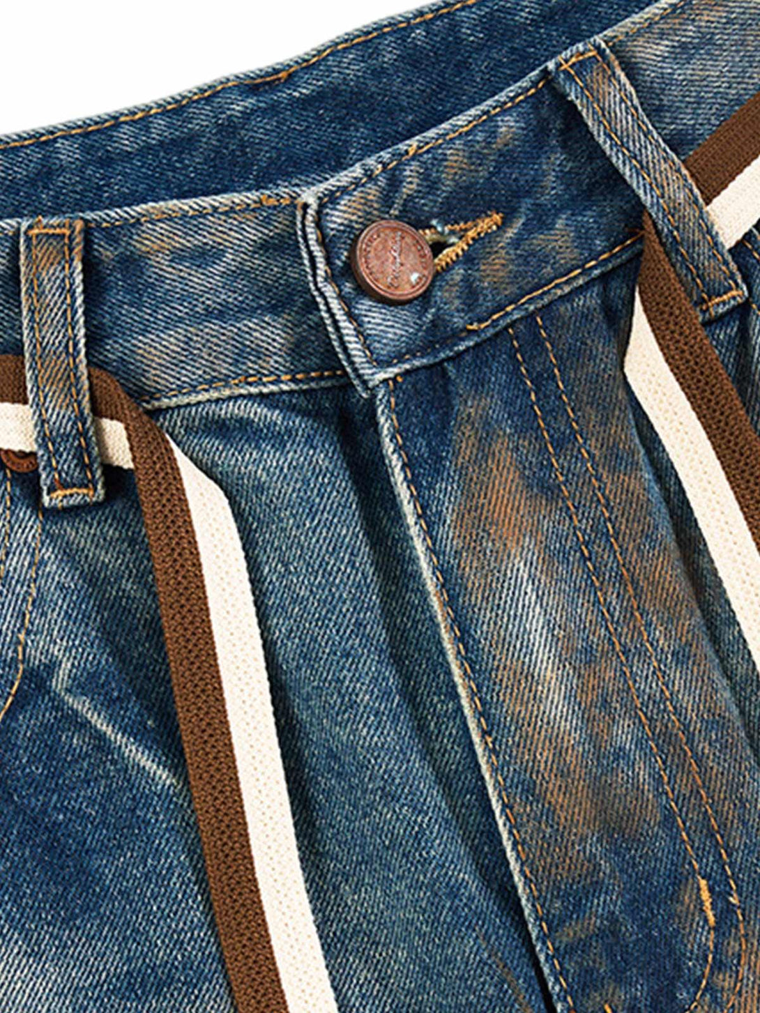 Detailed fabric and stitching of TALISHKO retro ink-splashed jeans, highlighting unique design.