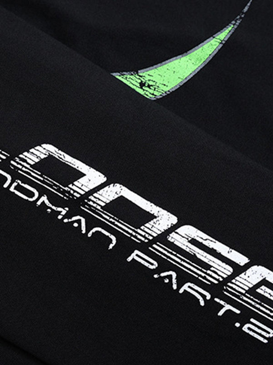 A close-up of graphic detail on TALISHKO's black oversized long-sleeve T-shirt.
