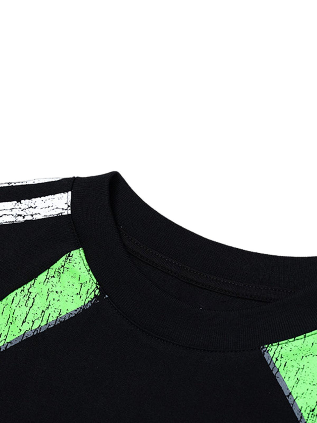 A tight crop highlighting the graphic design on TALISHKO's oversized retro long-sleeve T-shirt.