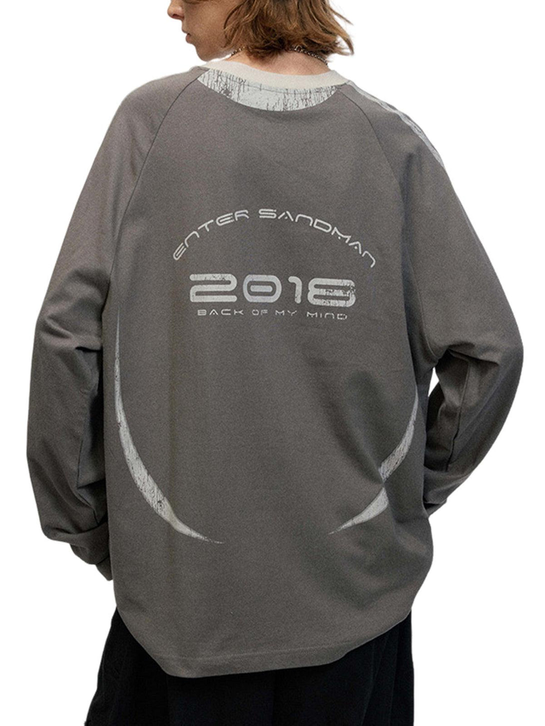 Back view of TALISHKO oversized long-sleeve T-shirt with retro graphics in a casual fit.