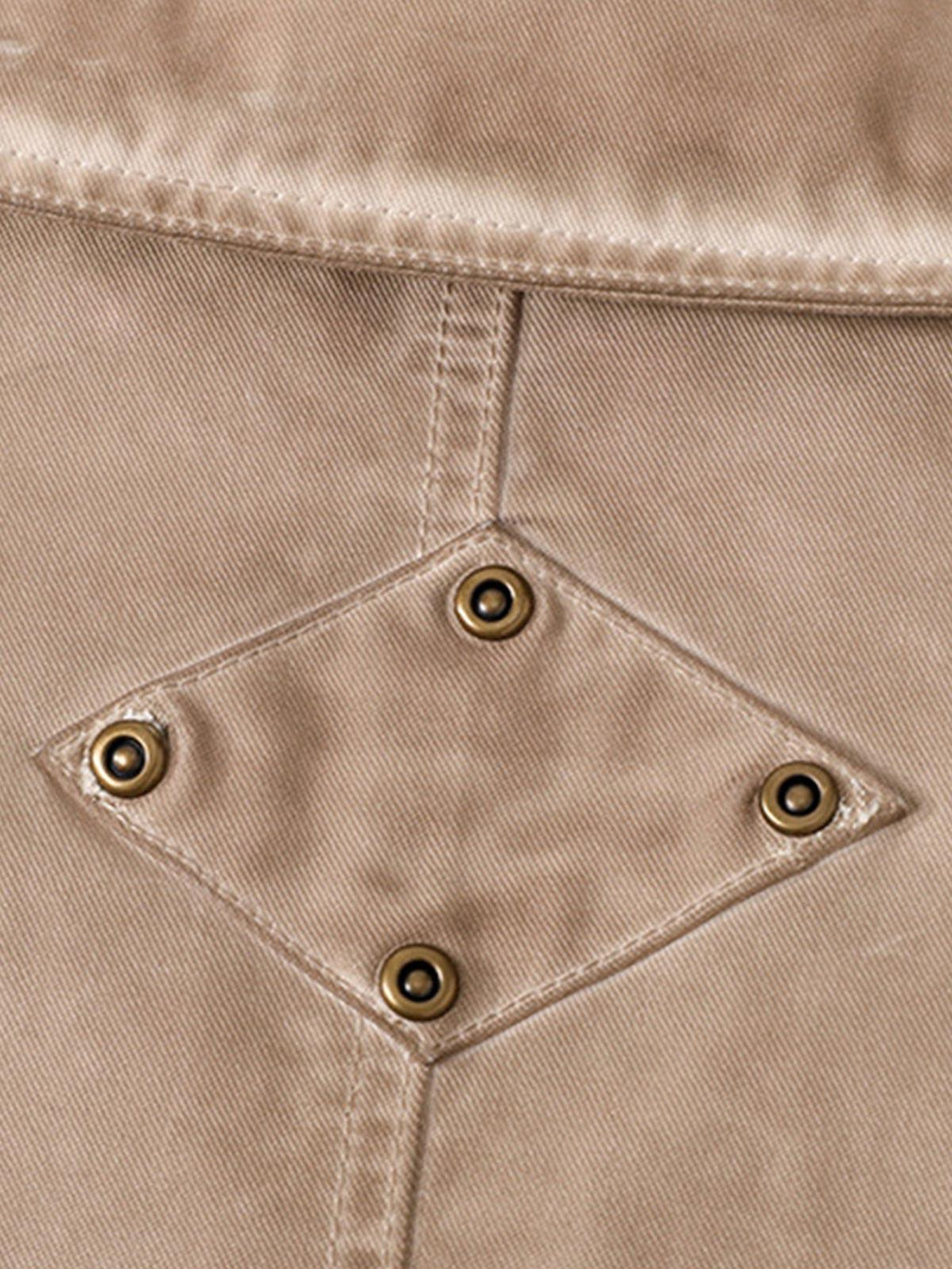 TALISHKO jacket's rich texture and button detail, showcasing retro workwear style.