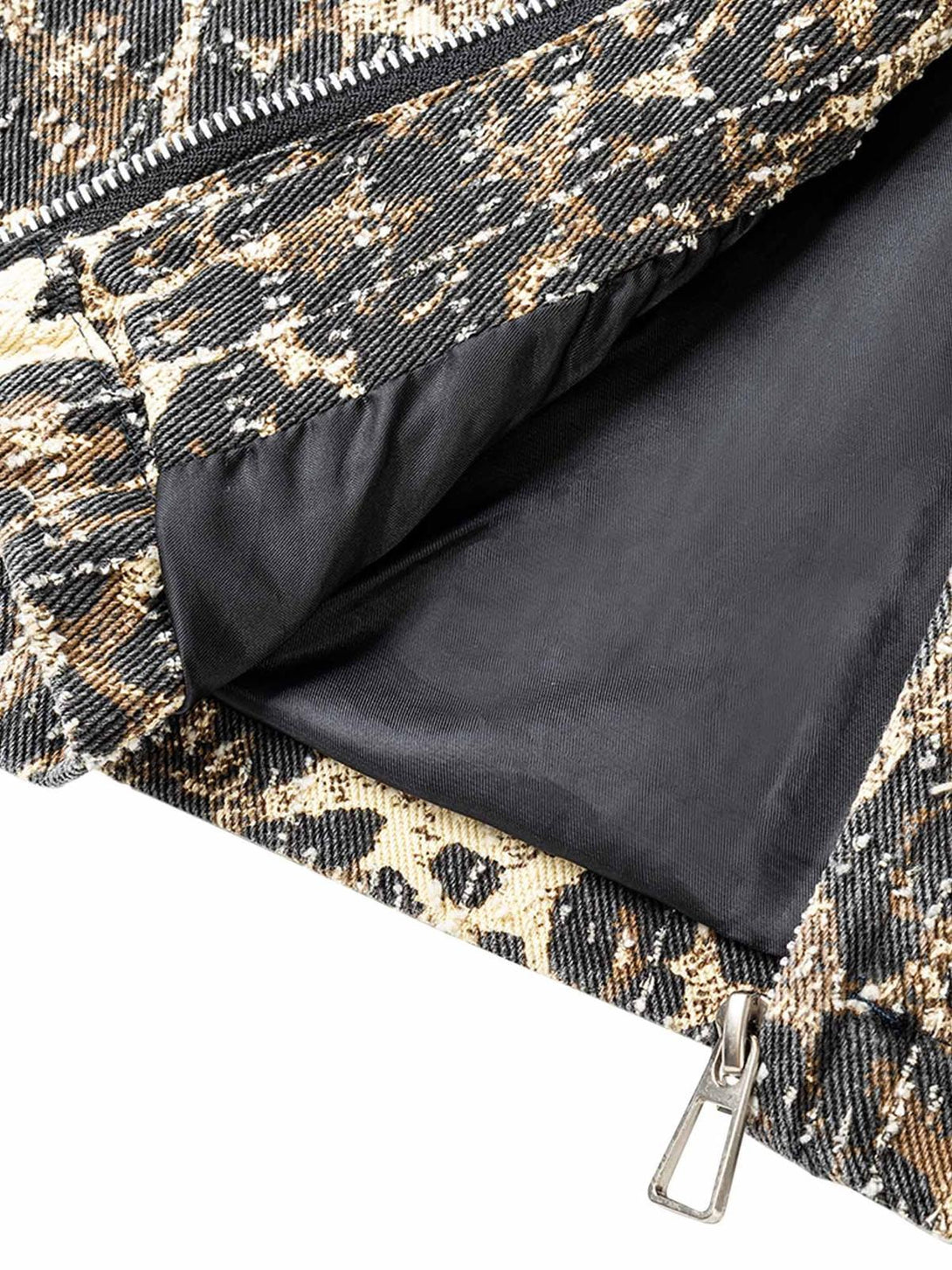 Detailed fabric and stitching of TALISHKO's retro leopard print denim jacket, highlighting texture.