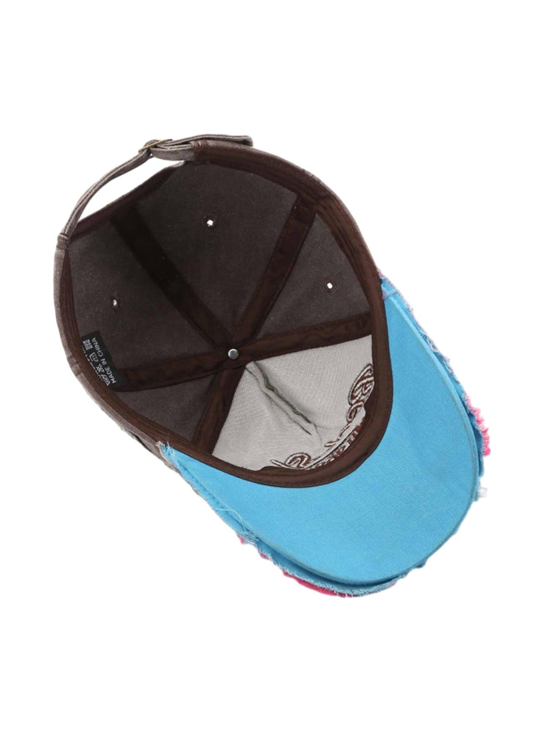 Interior view of a TALISHKO retro denim cap, highlighting the unique lining and stitching.