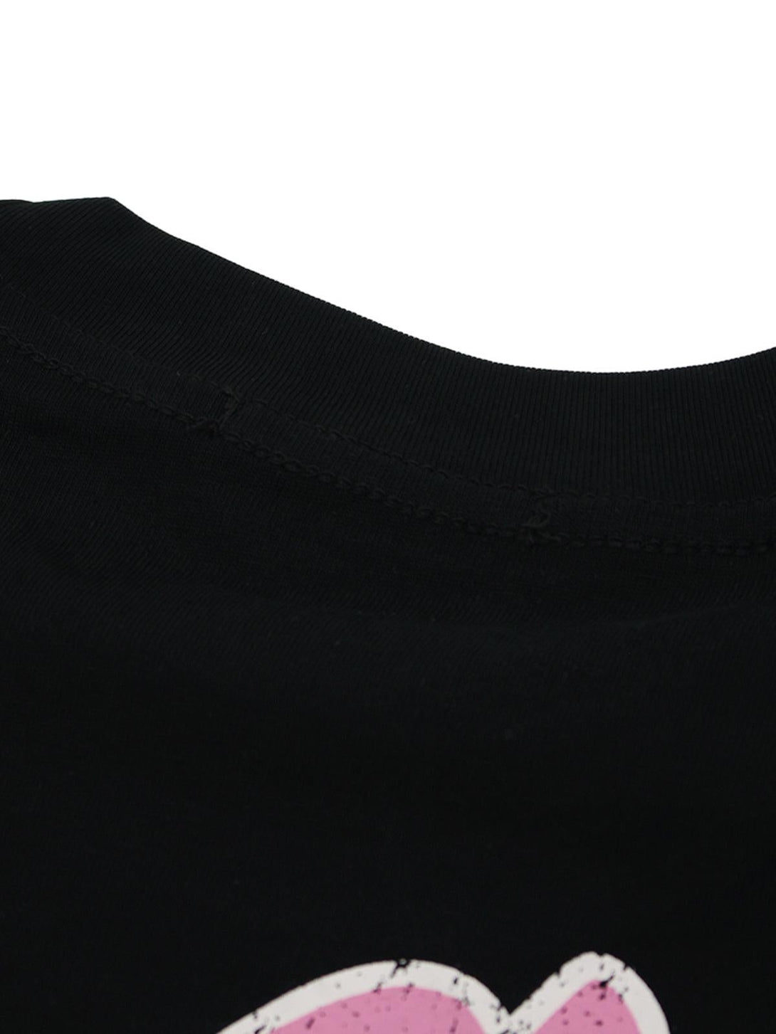 A detailed view of the neckline and texture on a black TALISHKO retro graphic T-shirt.