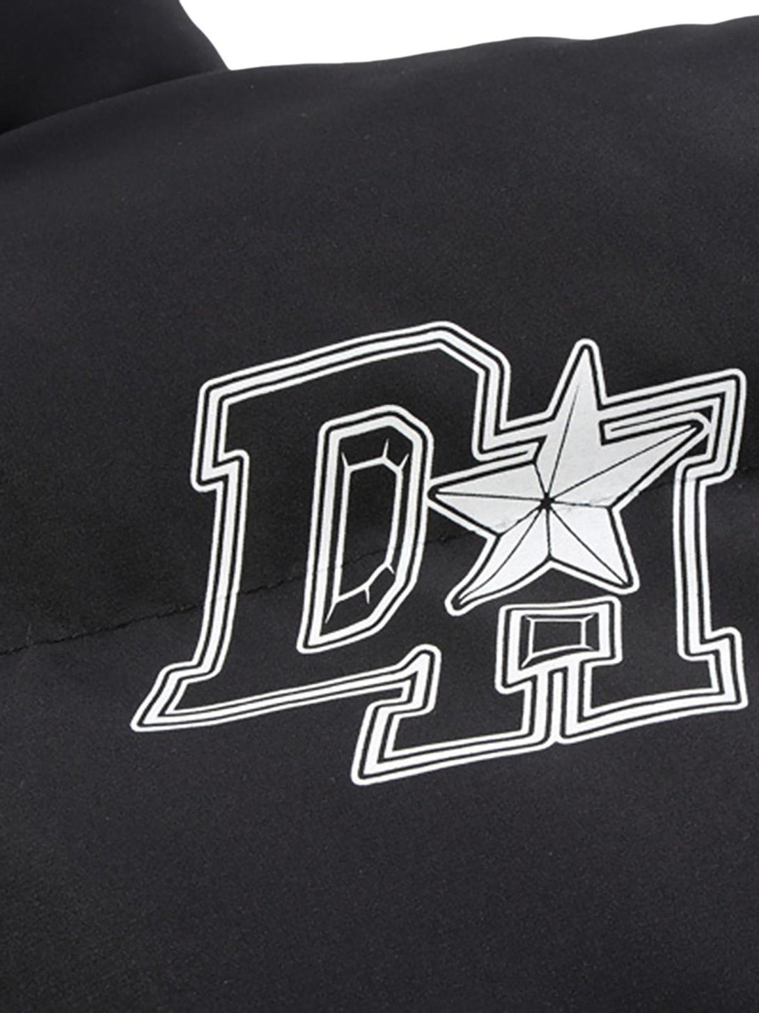 Close-up of TALISHKO down jacket featuring retro letter print and star detail.