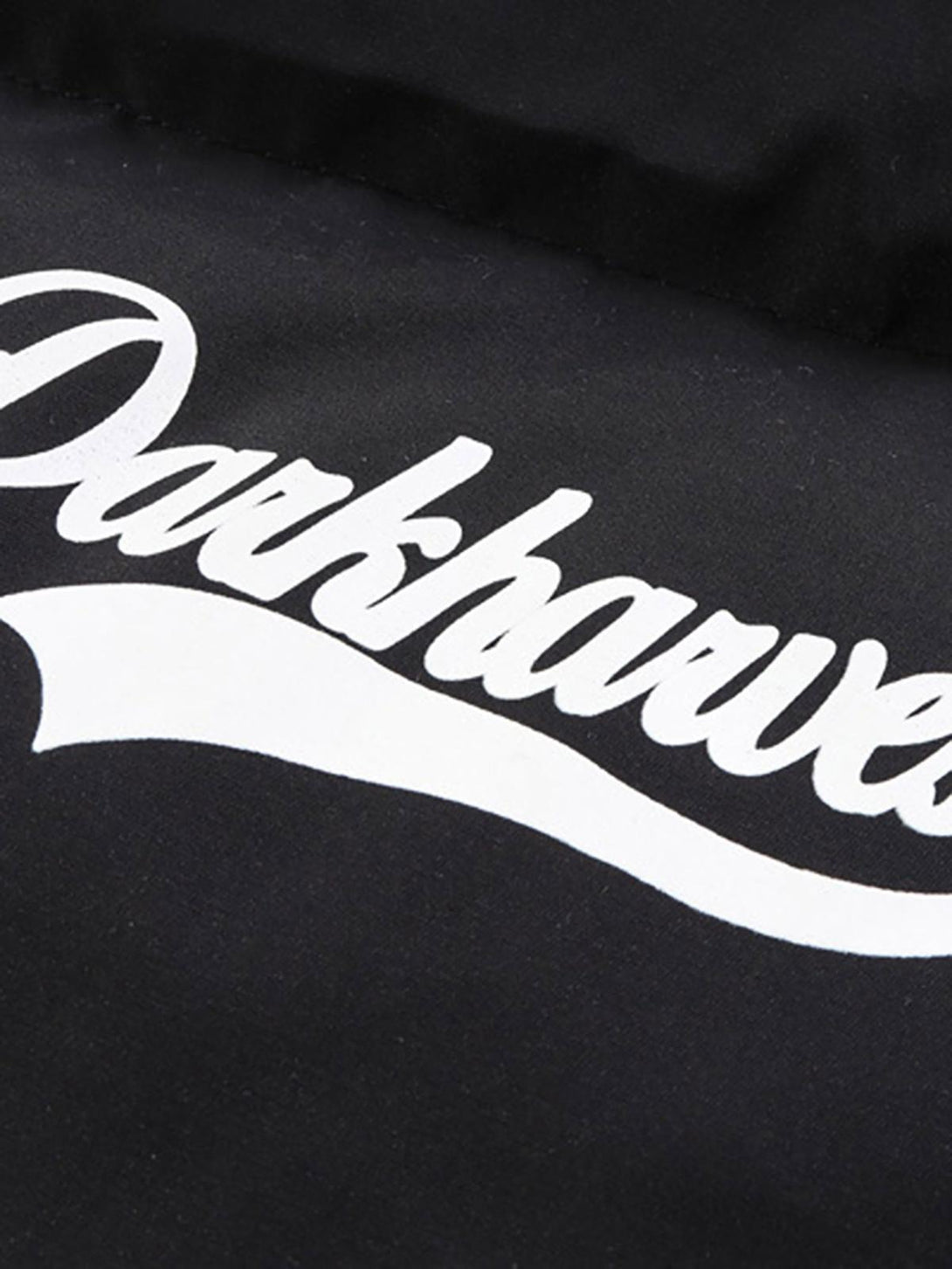 Zoomed-in view of TALISHKO down jacket showcasing retro letter print design.