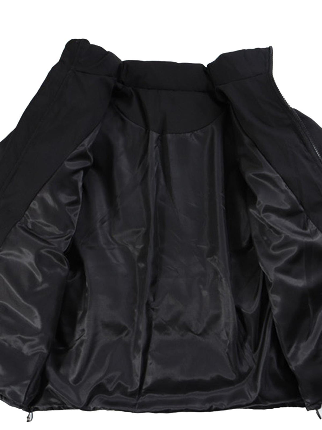 Interior view of TALISHKO down jacket, highlighting the smooth black lining and craftsmanship.