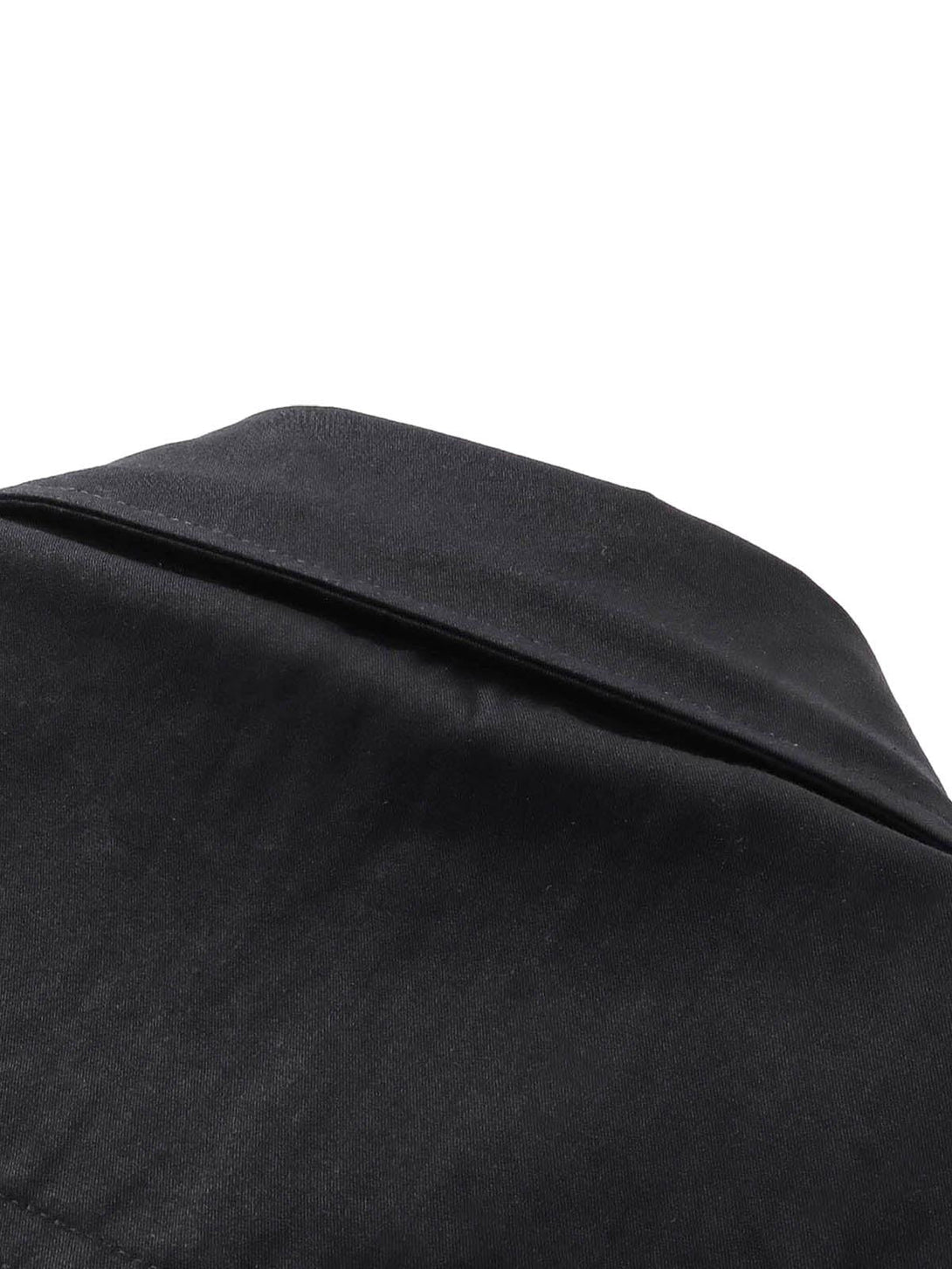 Zoomed-in texture of a black short sleeve shirt collar by TALISHKO.