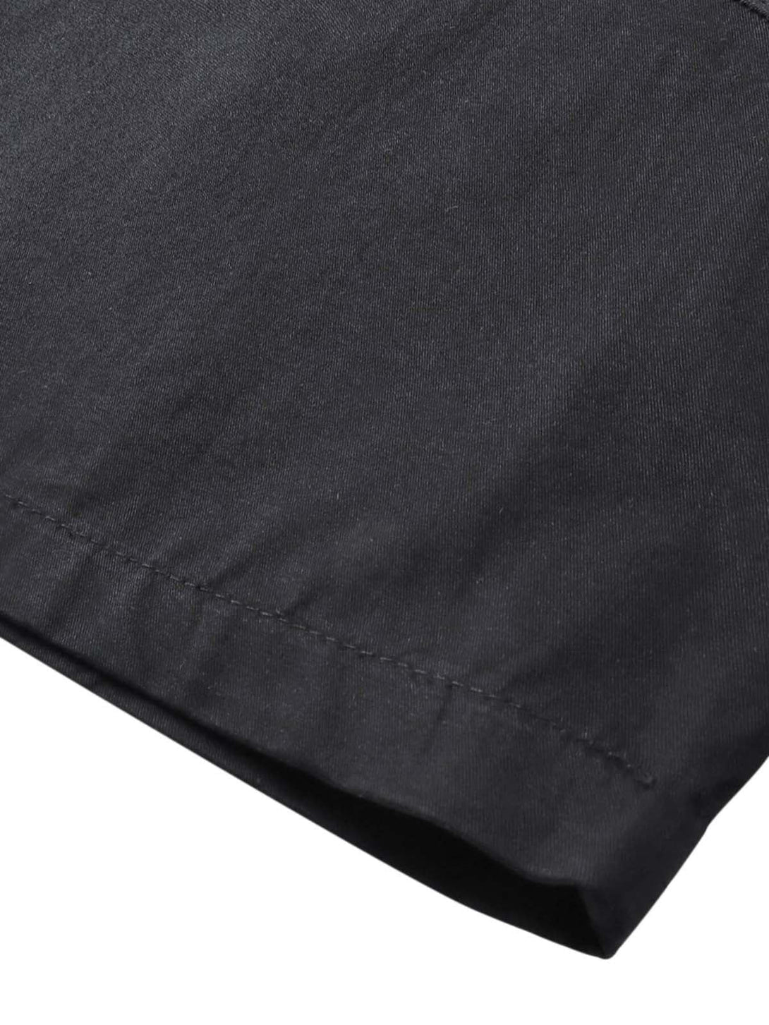 Detailed fabric and stitching on a black short sleeve shirt by TALISHKO.
