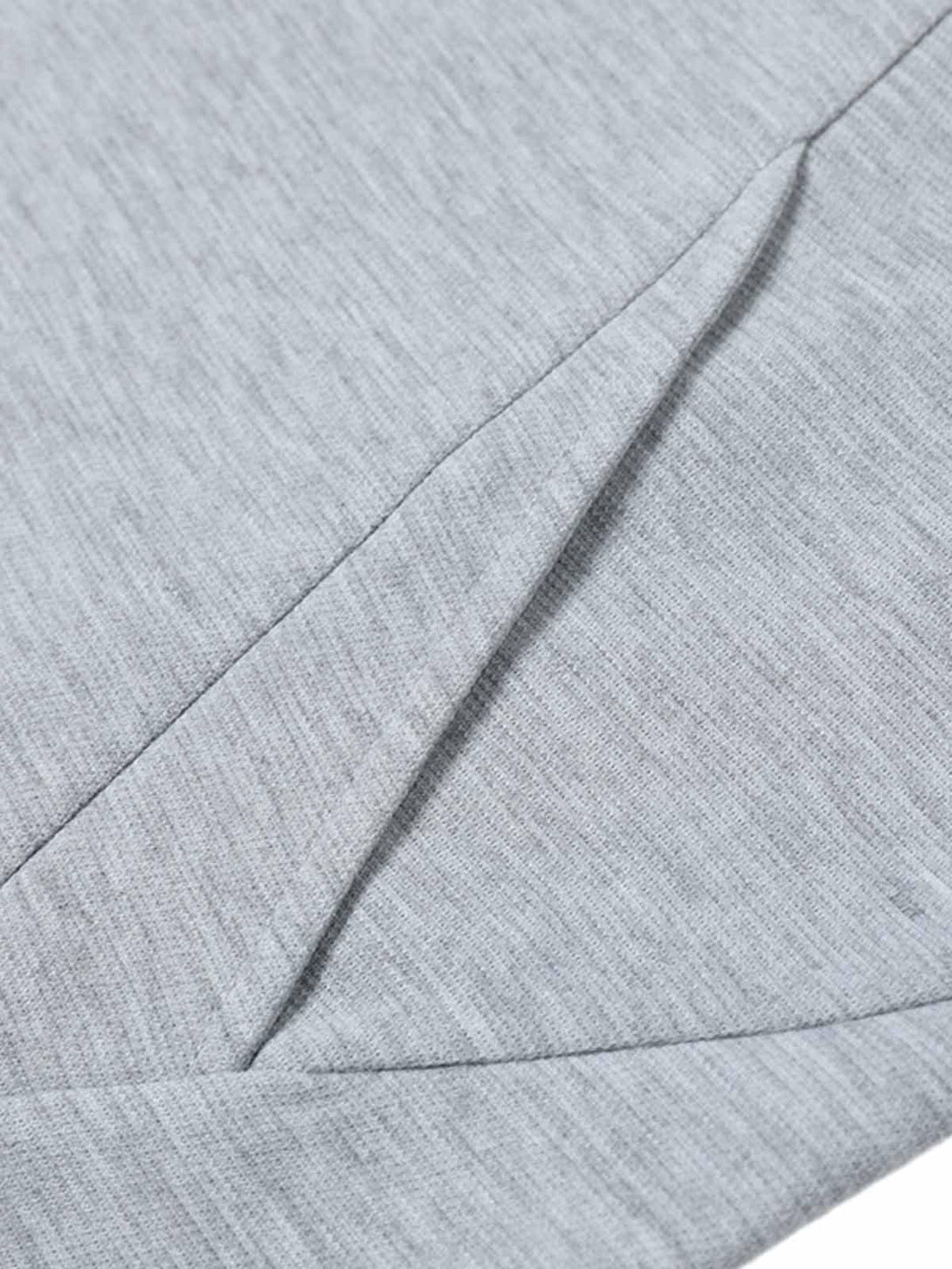 Zoomed-in texture of a gray T-shirt by TALISHKO, showcasing detailed fabric and stitching.