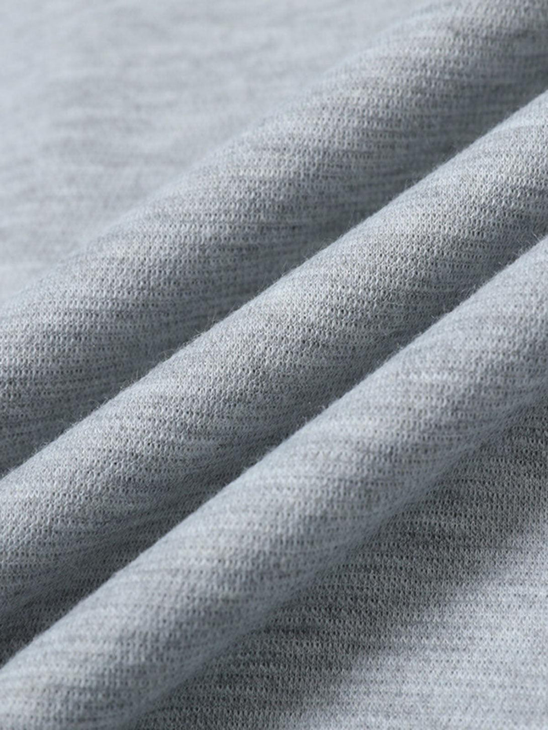 Detailed view of the gray T-shirt by TALISHKO, highlighting its soft, cleanfit texture.