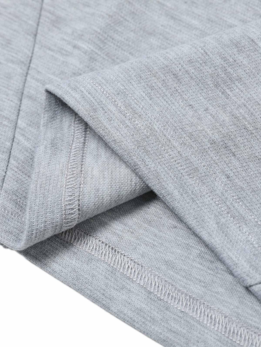 Intricate look at the gray T-shirt by TALISHKO, highlighting its texture and neat stitching.
