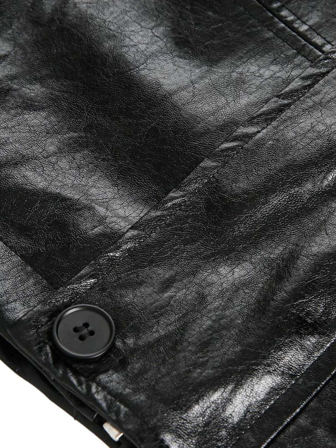 Intricate look at TALISHKO's retro motorcycle jacket texture and button detail.