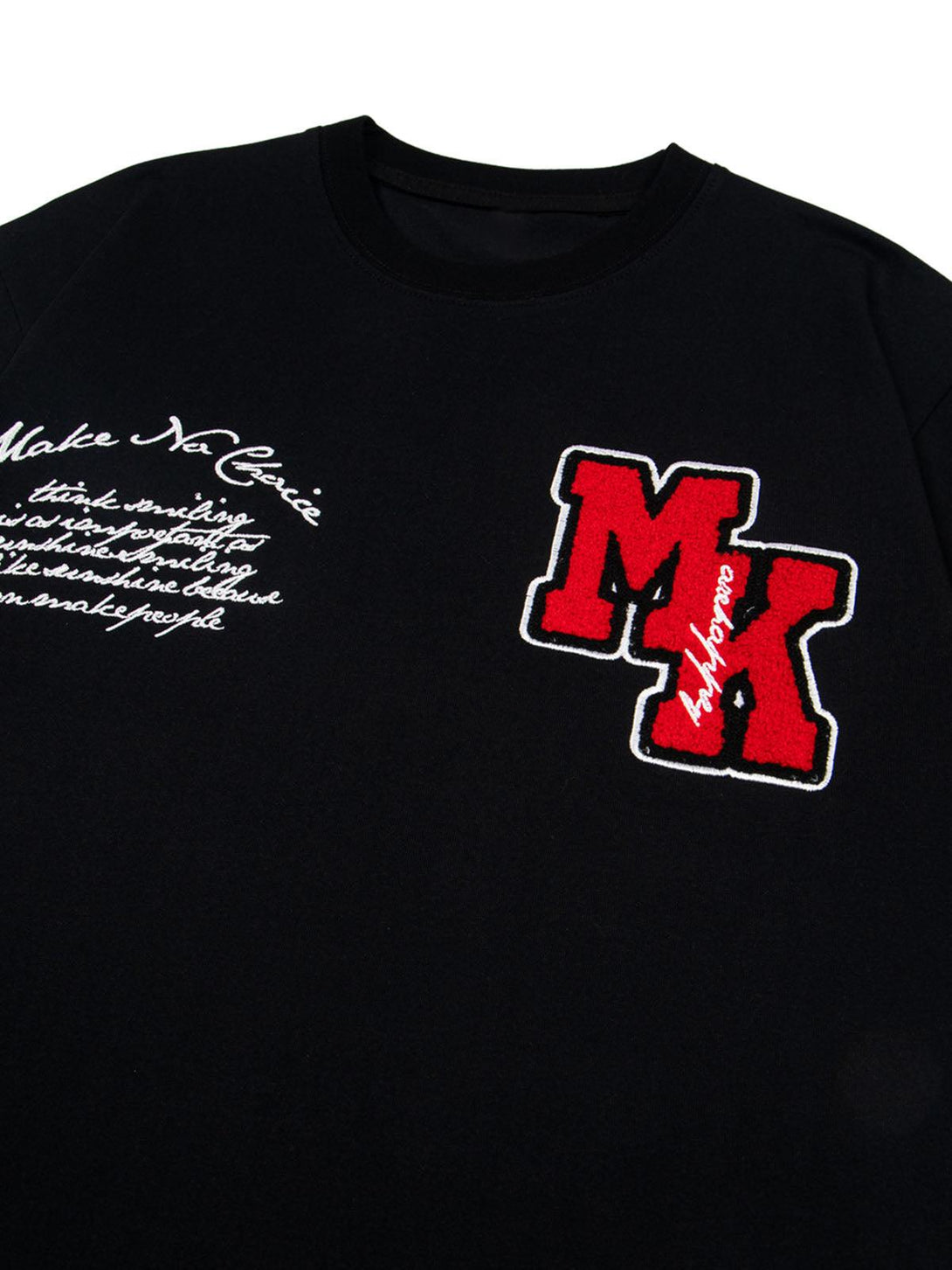 TALISHKO black T-shirt with bold red patches and intricate embroidery, capturing retro style.