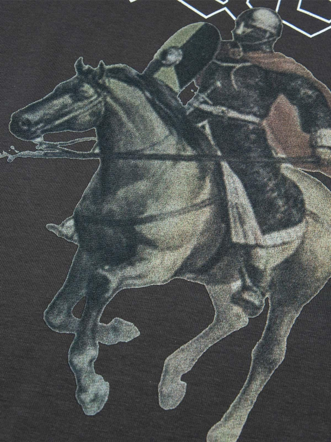A detailed view of a TALISHKO T-shirt featuring a vintage knight design on the fabric.