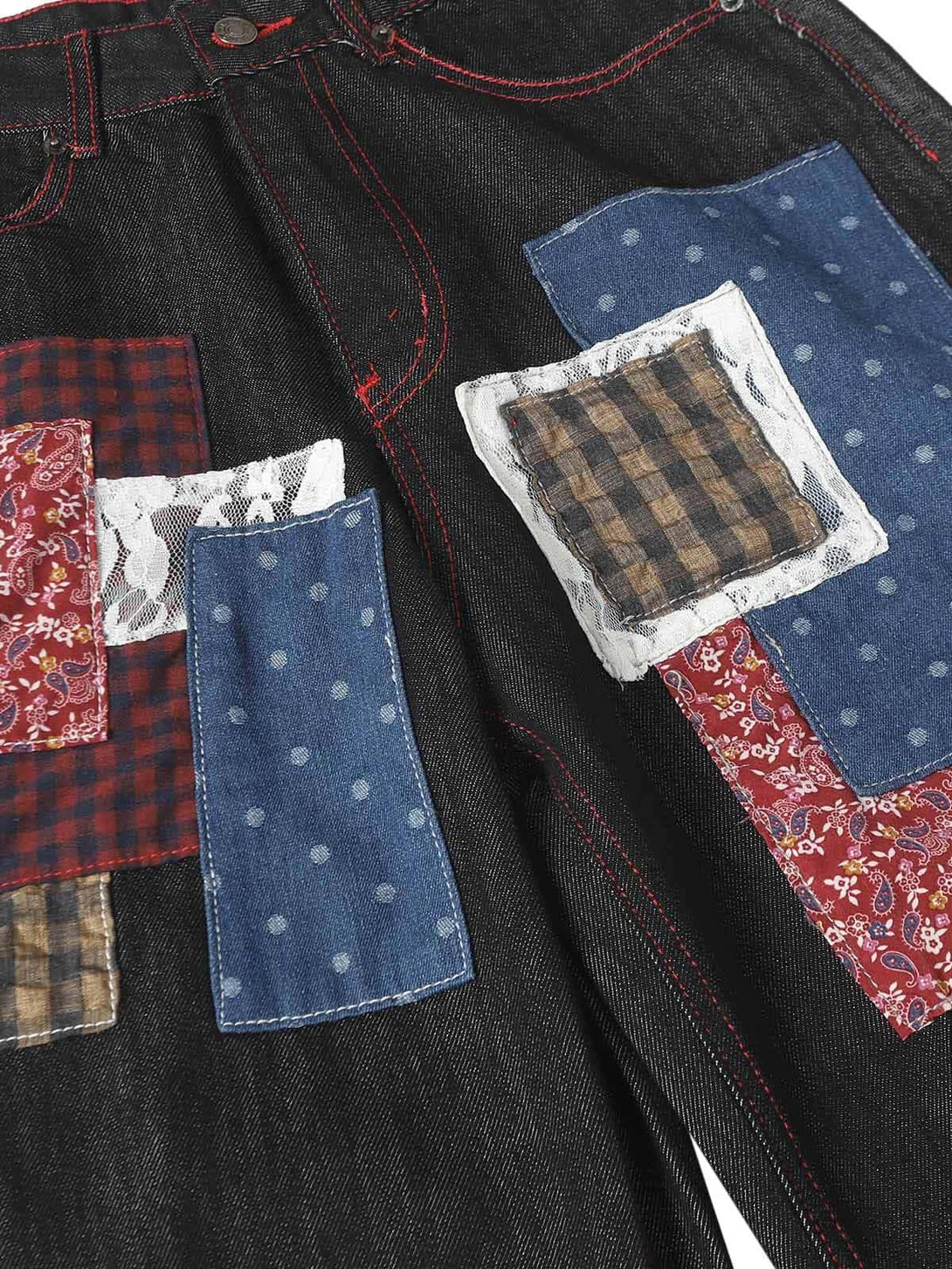 Intricate look at TALISHKO patchwork jeans, highlighting unique fabric textures and patterns.