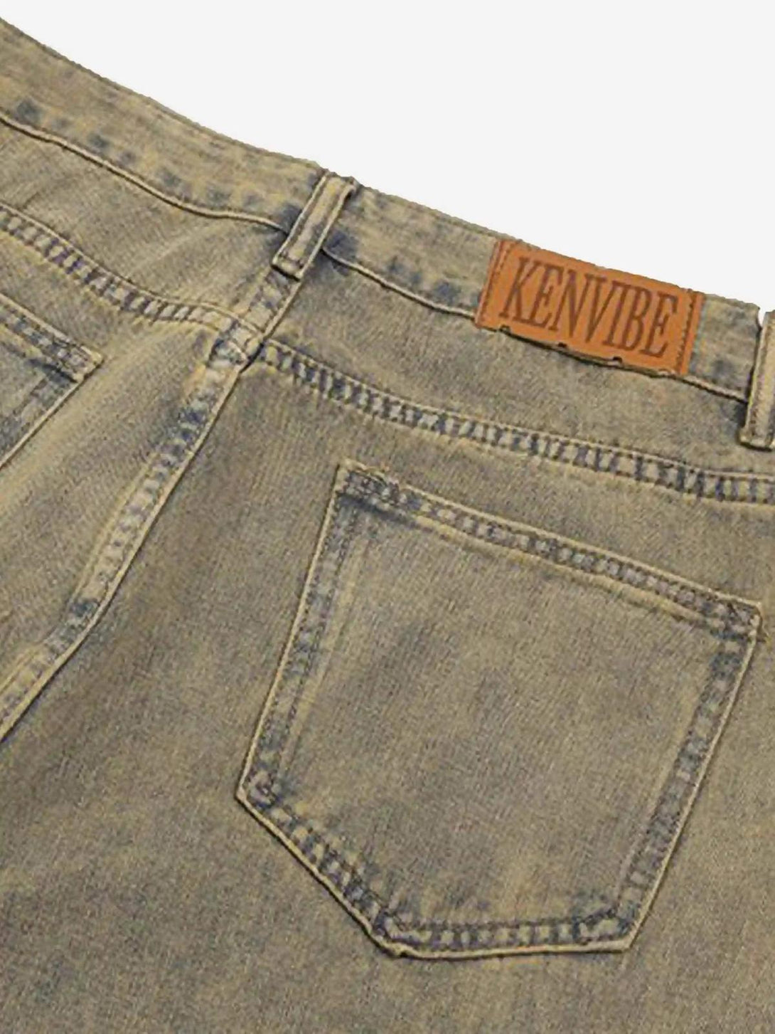 Back view of TALISHKO's retro flared jeans, featuring patchwork and unique denim styling.