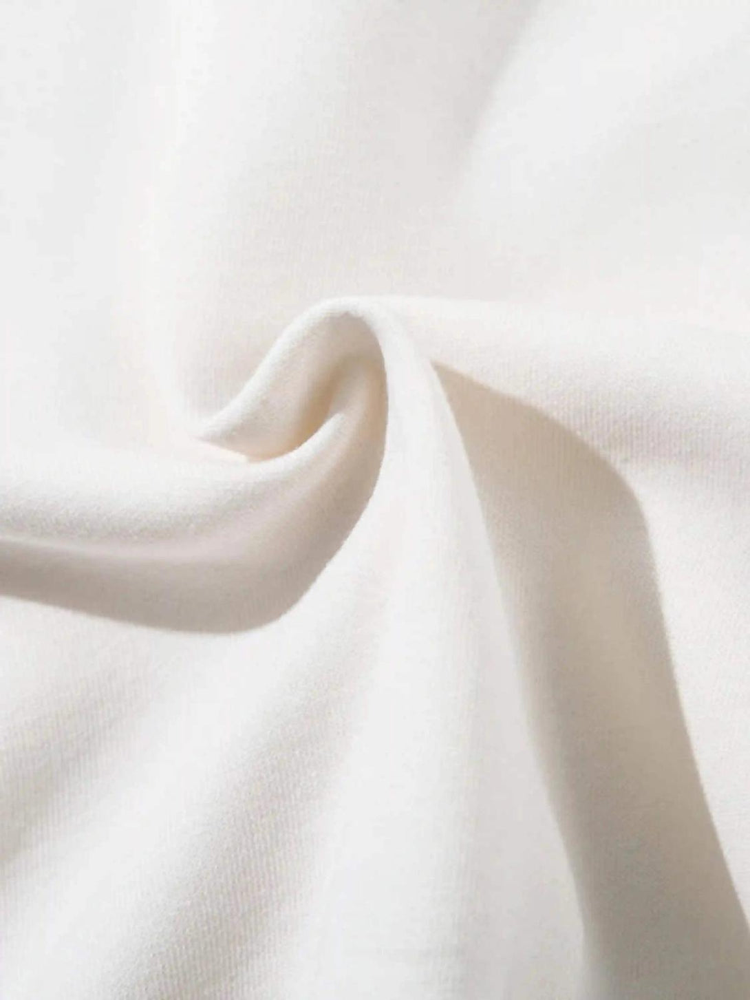 Zoomed-in texture of the TALISHKO hoodie, showcasing the soft fabric and intricate details.