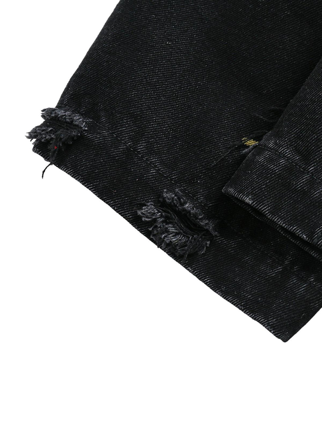 Frayed hem detail on TALISHKO's retro denim jacket, highlighting the textured finish.