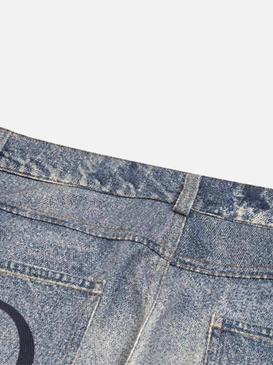 Detailed view of TALISHKO retro patchwork jeans, emphasizing the unique back pocket design.