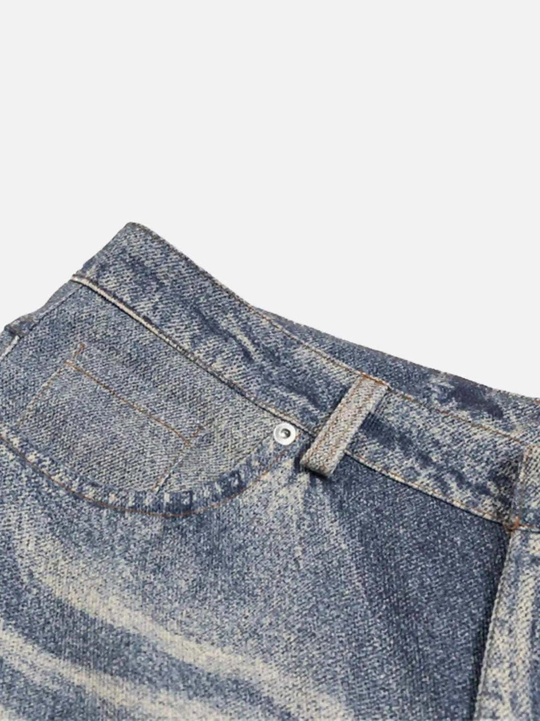 Zoomed-in view of TALISHKO retro patchwork street jeans highlighting intricate stitching.