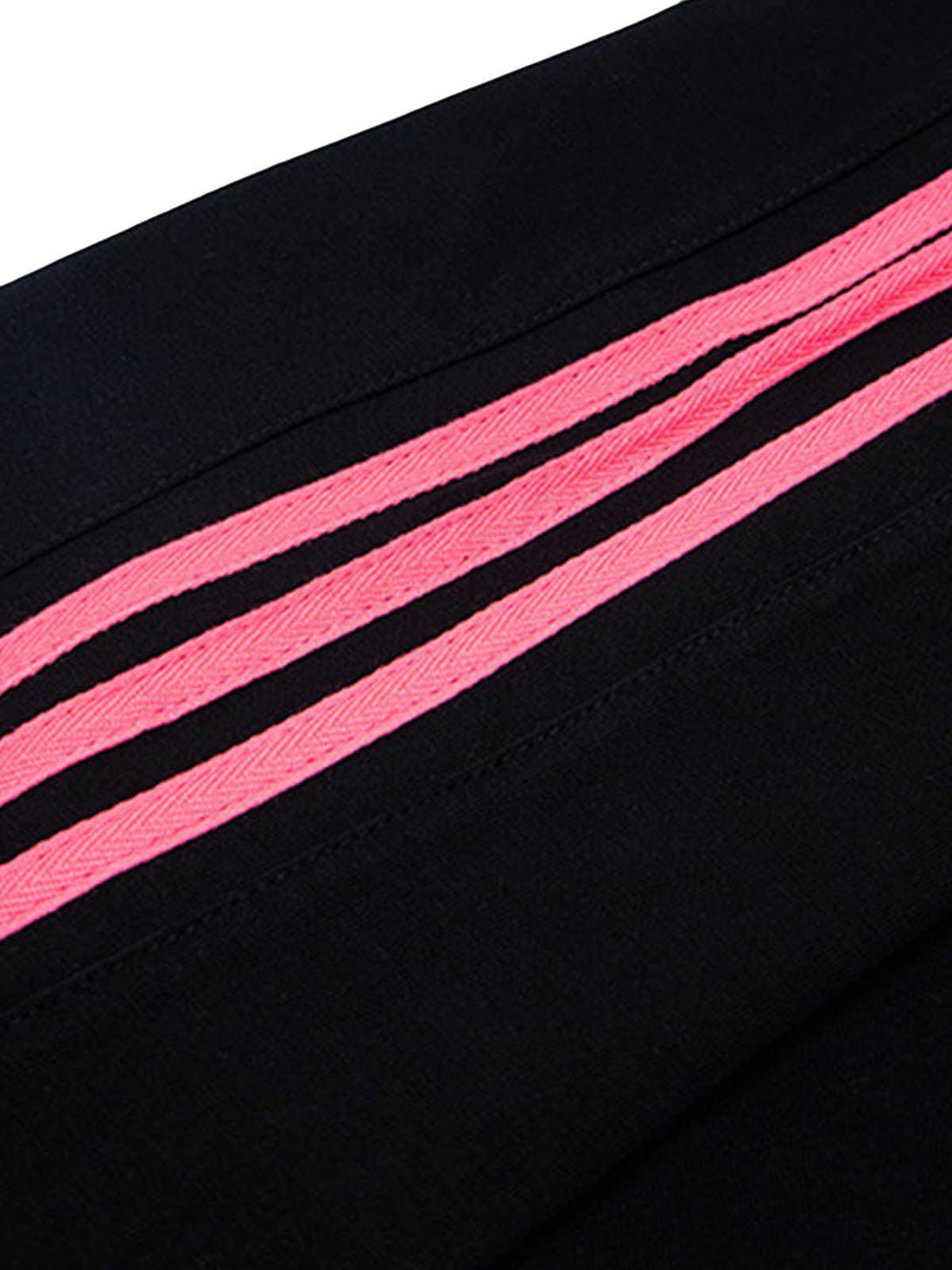 A detailed view of pink stripes on a black fabric by TALISHKO, showcasing vibrant design elements.