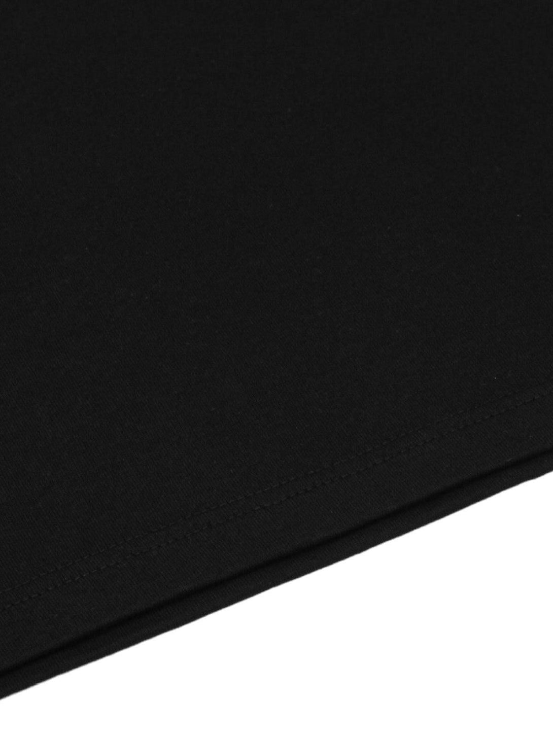 Detailed fabric and stitching on a black TALISHKO T-shirt, highlighting quality craftsmanship.