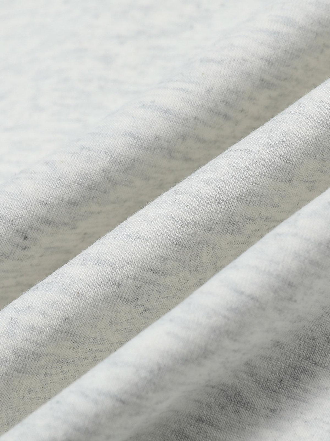 Intricate look at the soft fabric texture of TALISHKO's hooded sweatshirt, highlighting quality.