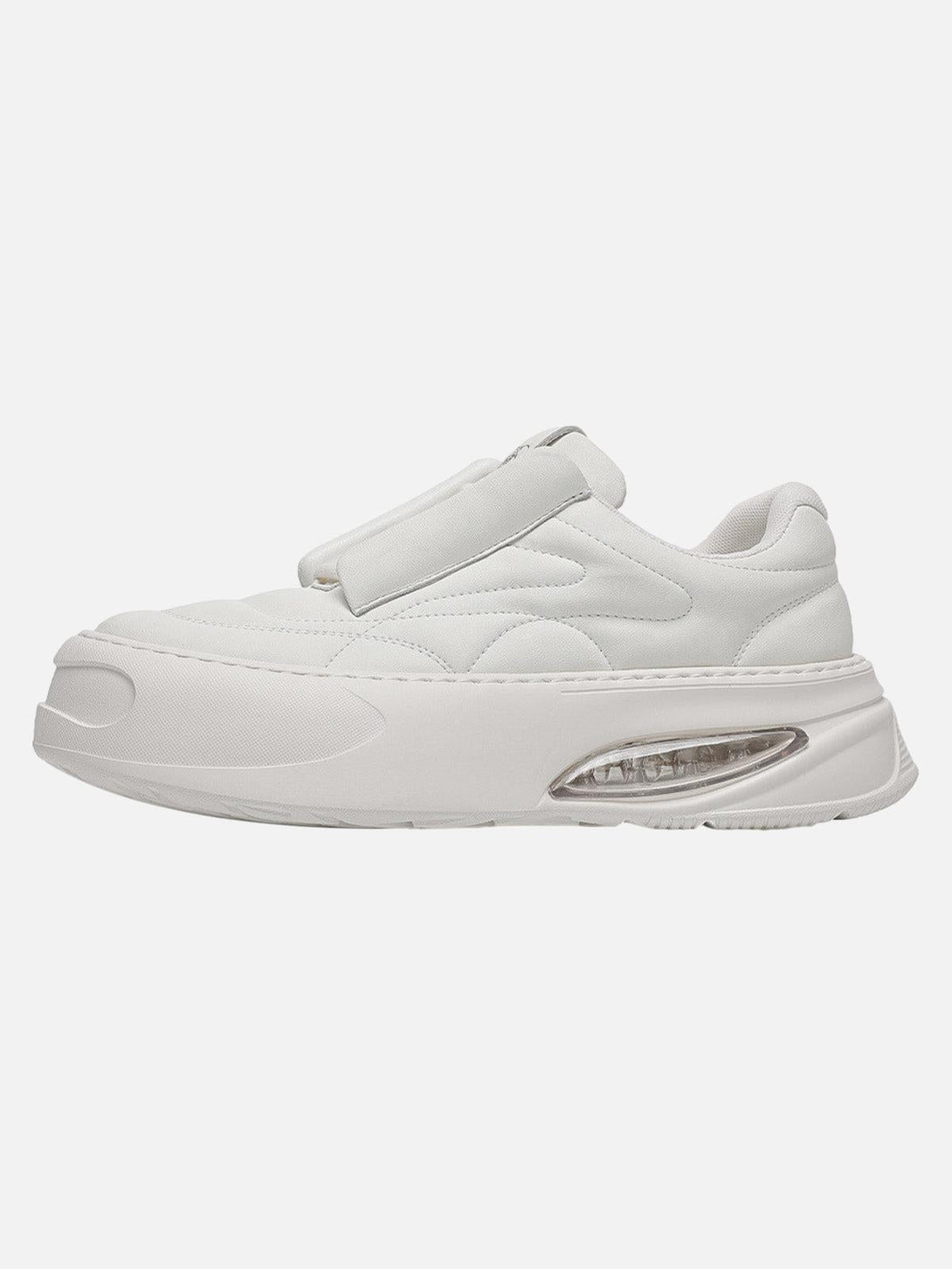 Side view of white retro platform skate shoes by TALISHKO, highlighting a unique design.