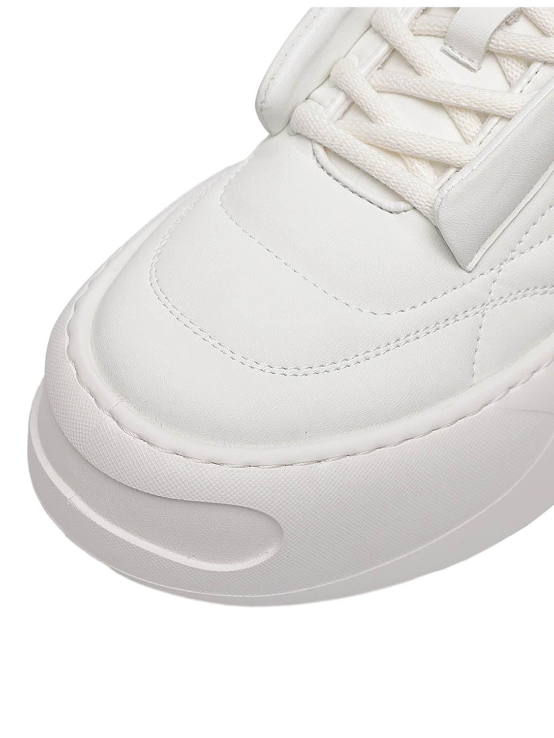 Focusing on the sleek design of TALISHKO retro platform skate shoes, highlighting stitching details.